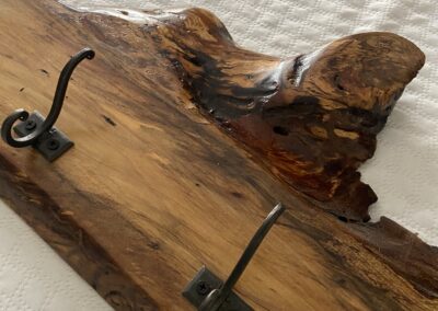 beautiful rustic coat rack made with spalted sweet gum with 5 coat hooks