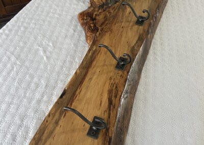 beautiful rustic coat rack made with spalted sweet gum with 5 coat hooks