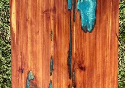 Cedar tabletop with aqua green epoxy resin