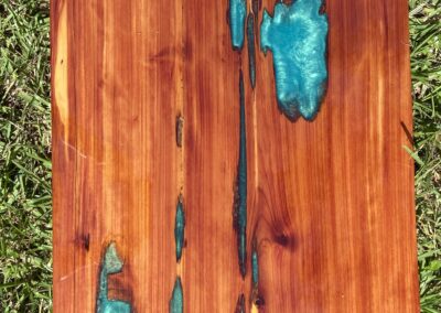 Cedar tabletop with aqua green epoxy resin