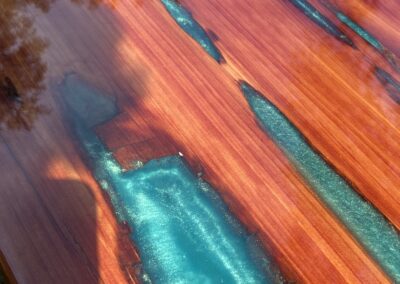 Cedar tabletop with aqua green epoxy resin