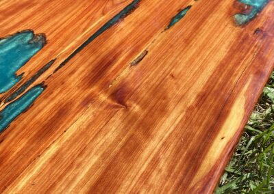 Cedar tabletop with aqua green epoxy resin