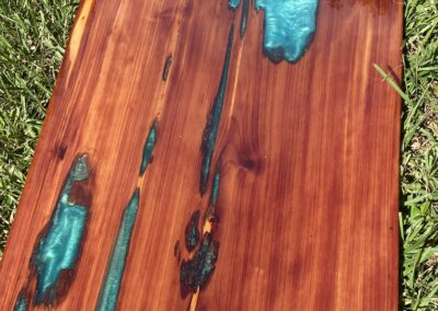 Cedar tabletop with aqua green epoxy resin