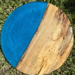 handmade 18" round tabletop made with spalted sweet gum and blue epoxy resin