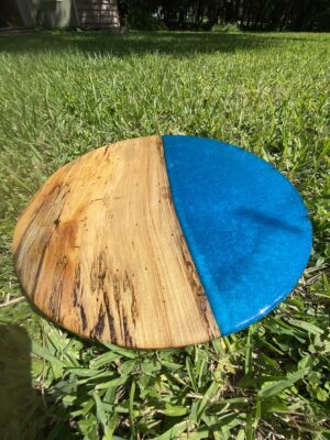 handmade 18" round tabletop made with spalted sweet gum and blue epoxy resin